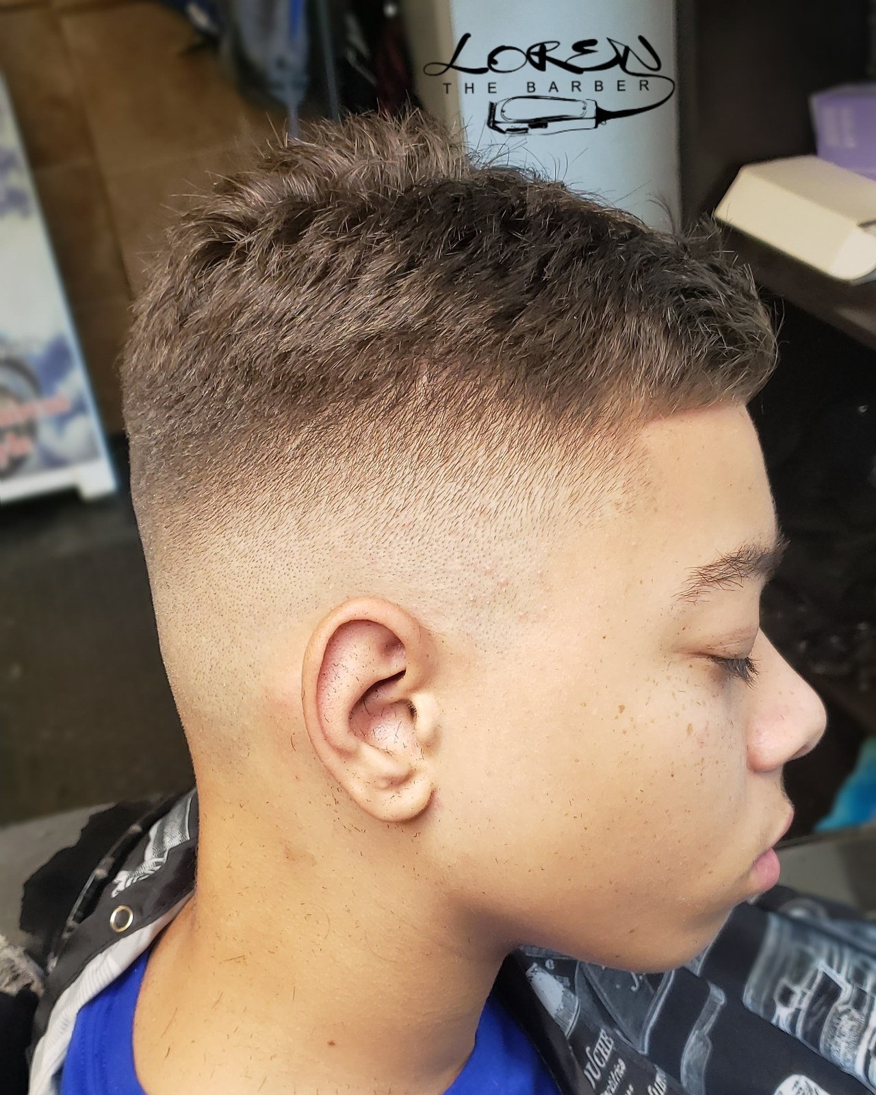 Kids lining with clean taper fade on sides