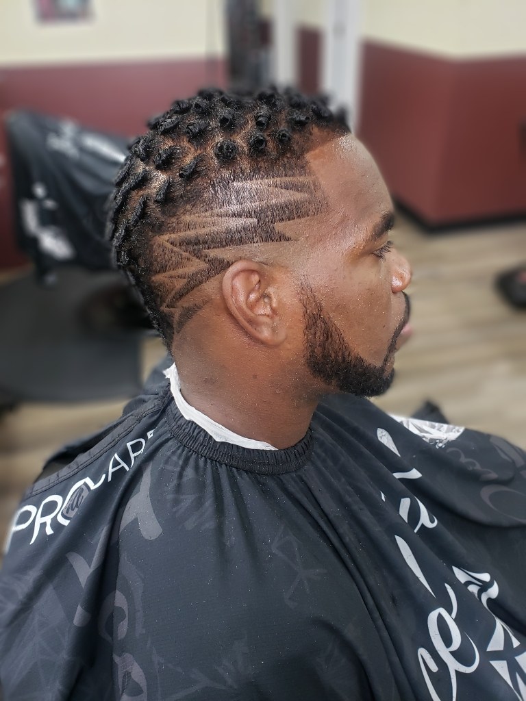 Precision freestyle razor design cut at Fade Away Barbershop